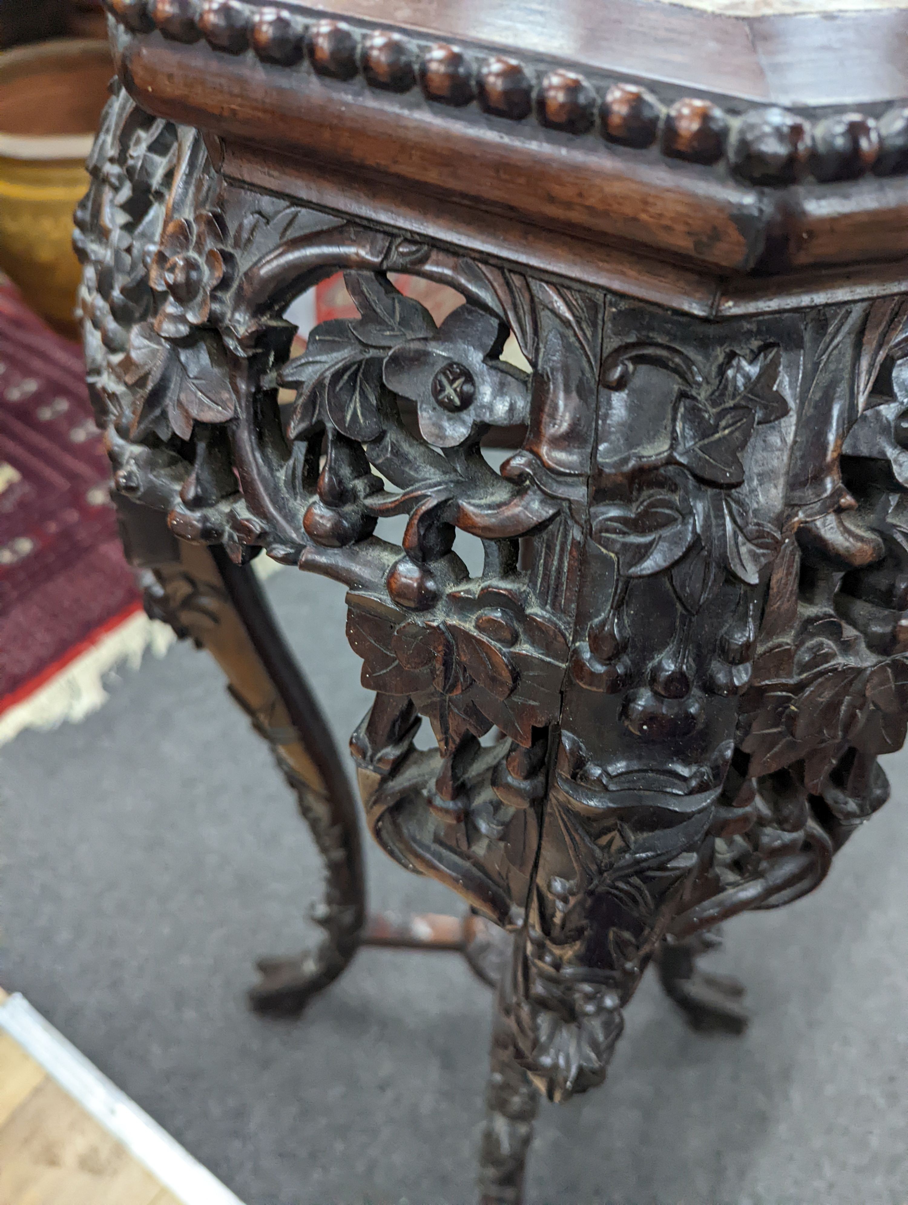 A Chinese hongmu marble topped jardiniere stand, early 20th century, height 90cm